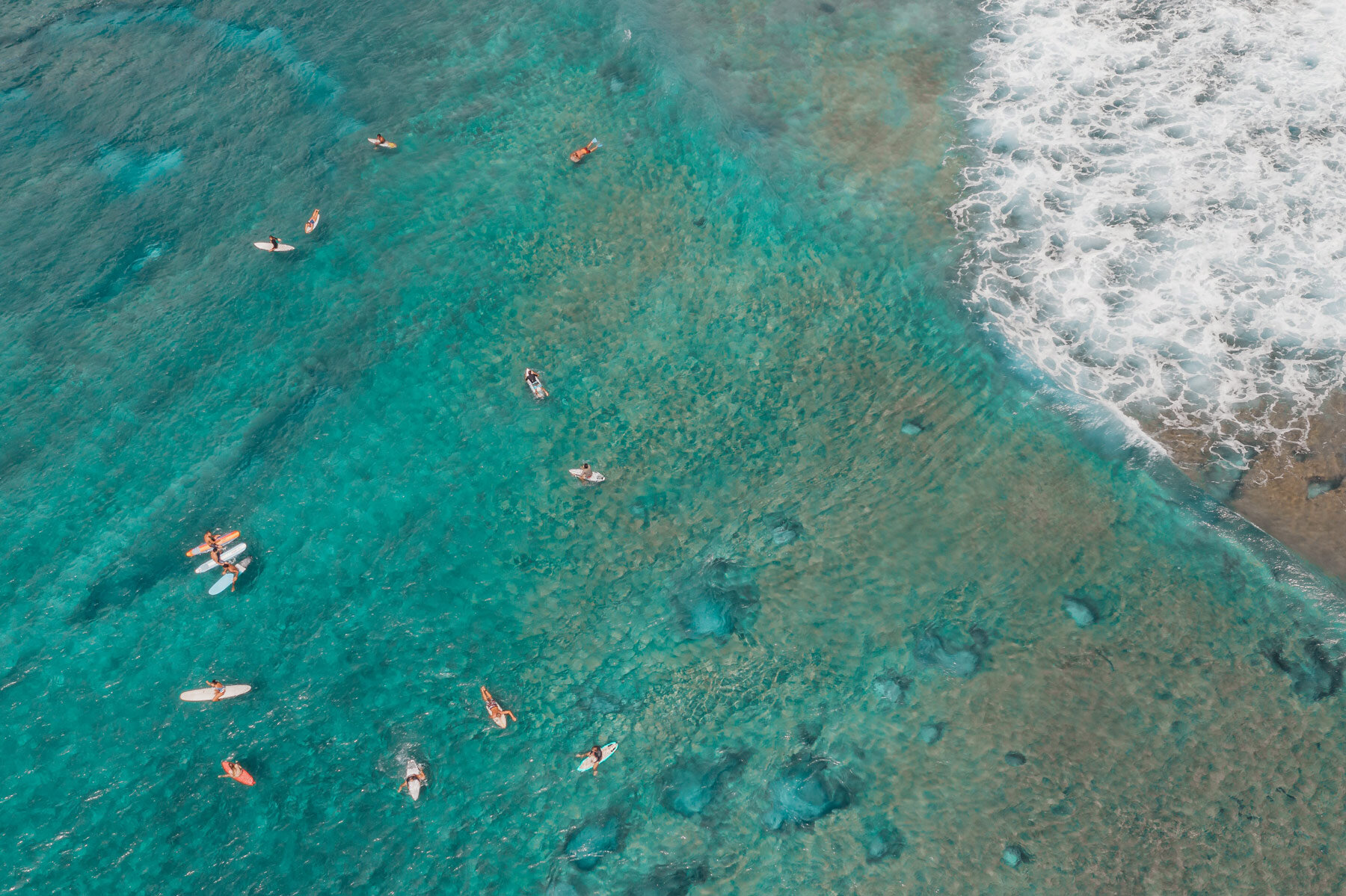 group of surfers in ocean
